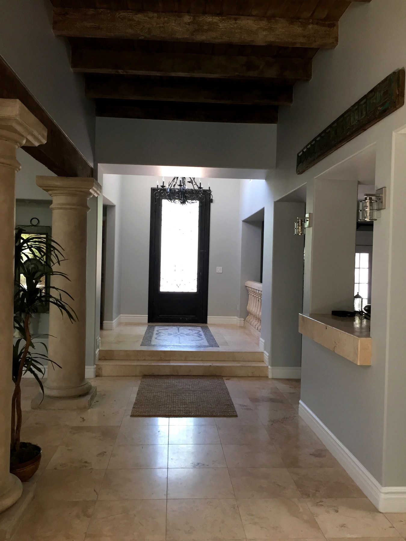 North Scottsdale remodeled entry with wood beams and stone columns